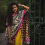 A woman poses in a sari at Alexander Muir Gardens