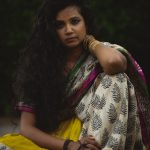 A woman poses in a sari at Alexander Muir Gardens